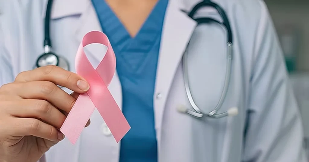 Doctor holding a pink ribbon